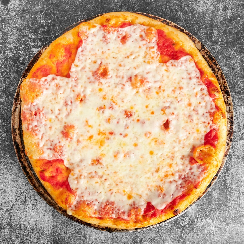 Trent's Pizzeria's classic cheese pizza, with melted mozzarella and red sauce, on a dark background.