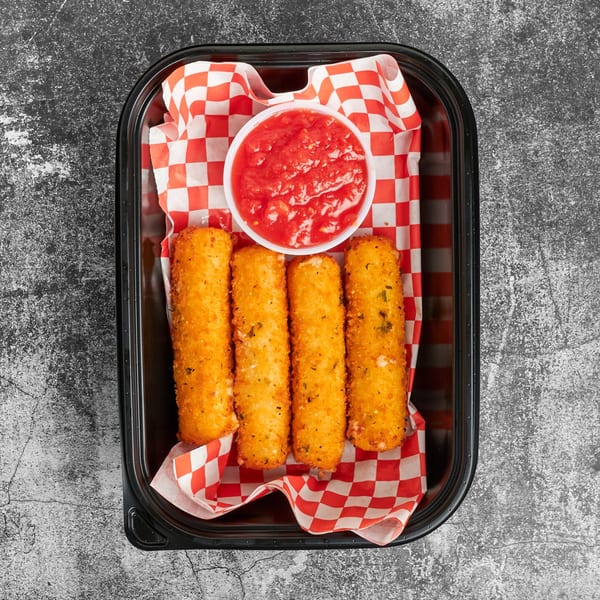 Four golden-brown mozzarella sticks and a cup of marinara sauce in a black container with red and white checkered paper.